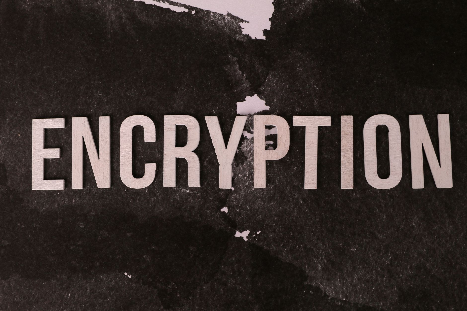 Black and white abstract image with the word 'ENCRYPTION' prominently displayed.